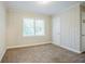 Cozy bedroom featuring neutral paint, carpeted floor, and ample natural light at 2529 Habersham Dr, Decatur, GA 30032