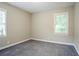 Bedroom featuring neutral paint, carpeted floor, and ample natural light at 2529 Habersham Dr, Decatur, GA 30032