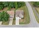 An aerial view of a beautiful two-story home with an attached garage and well-maintained lawn and trees at 4405 Feather Way, Douglasville, GA 30135