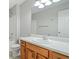 Bathroom with light countertop and wood vanity, including a bathtub and toilet at 4405 Feather Way, Douglasville, GA 30135