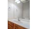 Bathroom vanity featuring a mirror, and a sink with wood colored cabinets below at 4405 Feather Way, Douglasville, GA 30135