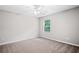 Bedroom with a ceiling fan, window with blinds, and gray carpet at 4405 Feather Way, Douglasville, GA 30135