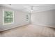 This neutral bedroom boasts natural light from the two windows, along with ceiling fan at 4405 Feather Way, Douglasville, GA 30135