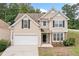 Charming two-story home with neutral siding, black shutters, and a two-car garage at 4405 Feather Way, Douglasville, GA 30135