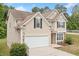 Charming two-story home with neutral siding, black shutters, and a two-car garage at 4405 Feather Way, Douglasville, GA 30135