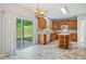 Functional kitchen with an island, sliding glass doors to the yard and white appliances at 4405 Feather Way, Douglasville, GA 30135