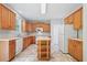 The kitchen features an island, white appliances and light-colored countertops and cabinets at 4405 Feather Way, Douglasville, GA 30135