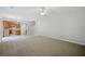 Inviting living room with adjacent kitchen, featuring carpet floors and neutral paint at 4405 Feather Way, Douglasville, GA 30135