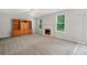 Inviting living room featuring a fireplace, built-in shelves, and large windows at 4405 Feather Way, Douglasville, GA 30135