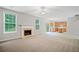 Bright, open living room features a fireplace and blends seamlessly into the adjacent kitchen area at 4405 Feather Way, Douglasville, GA 30135