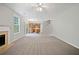 Spacious living room with cozy fireplace and neutral tones leads into open kitchen area at 4405 Feather Way, Douglasville, GA 30135