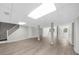 Spacious basement with updated flooring, white ceilings, and support beams at 7300 Wynhill Dr, Sandy Springs, GA 30328