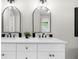 Bright bathroom featuring double sink vanity with black hardware and modern mirrors at 7300 Wynhill Dr, Sandy Springs, GA 30328