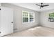 Bright bedroom featuring hardwood floors, neutral tones, lots of light, and ceiling fan at 7300 Wynhill Dr, Sandy Springs, GA 30328