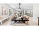 Open-concept dining room with large windows, stylish table setting, and contemporary decor at 7300 Wynhill Dr, Sandy Springs, GA 30328