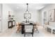 Elegant dining room featuring stylish decor, a modern light fixture, and a serene ambiance at 7300 Wynhill Dr, Sandy Springs, GA 30328