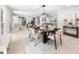 Bright dining room featuring a modern table, stylish chairs, and elegant lighting at 7300 Wynhill Dr, Sandy Springs, GA 30328