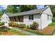 Well-maintained single-Gathering home with a lush lawn and covered porch, ideal for suburban living at 7300 Wynhill Dr, Sandy Springs, GA 30328