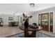 Charming foyer with a dark wood door, decorative table, and views of the dining area at 7300 Wynhill Dr, Sandy Springs, GA 30328