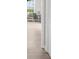 Hallway with hardwood floors looks into a bright living room at 7300 Wynhill Dr, Sandy Springs, GA 30328