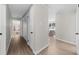 Bright hallway with hardwood floors leads to rooms in a home's layout at 7300 Wynhill Dr, Sandy Springs, GA 30328