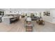 Open concept living space with kitchen, dining, and living areas featuring hardwood floors and recessed lighting at 7300 Wynhill Dr, Sandy Springs, GA 30328