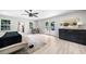 Bright main bedroom with hardwood floors, dresser, walkout to patio and seating area at 7300 Wynhill Dr, Sandy Springs, GA 30328