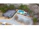 Aerial view showcasing community amenities: tennis court, pool, and clubhouse at 1116 Silverbrooke Dr, Powder Springs, GA 30127