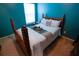 Cozy bedroom with a bright accent wall, a comfortable bed, and natural light at 1116 Silverbrooke Dr, Powder Springs, GA 30127