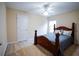 Cozy bedroom with a ceiling fan, comfortable bed, and ample natural light at 1116 Silverbrooke Dr, Powder Springs, GA 30127