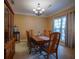 Elegant dining room with a chandelier, window, and furniture, perfect for gatherings at 1116 Silverbrooke Dr, Powder Springs, GA 30127