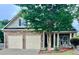 Charming two-story home with stone accents, a well-manicured lawn, and a two-car garage at 1116 Silverbrooke Dr, Powder Springs, GA 30127