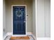 Stylish front door with a wreath, offering a warm welcome to this charming home at 1116 Silverbrooke Dr, Powder Springs, GA 30127