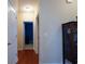 Hallway with hardwood floors leading to various rooms, showcasing the home's layout at 1116 Silverbrooke Dr, Powder Springs, GA 30127