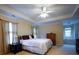 Spacious primary bedroom with tray ceilings, dual windows, and a comfortable layout at 1116 Silverbrooke Dr, Powder Springs, GA 30127