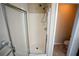 Shower with glass door and built-in shelves for toiletries at 1116 Silverbrooke Dr, Powder Springs, GA 30127