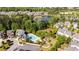 Aerial view of community with a pool, a playground, a lake, and lush green spaces at 127 Marlow Dr, Woodstock, GA 30188