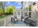 Relaxing back deck showcasing a seating area with a modern lattice privacy screen and backyard views at 127 Marlow Dr, Woodstock, GA 30188
