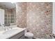 Charming bathroom with floral wallpaper, modern vanity, and glass-enclosed shower at 127 Marlow Dr, Woodstock, GA 30188