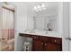 Bright bathroom features a large mirror, white countertop, and a separate toilet area, maximizing space and functionality at 127 Marlow Dr, Woodstock, GA 30188