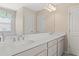 Bathroom with dual sinks, large mirror, and white countertops at 127 Marlow Dr, Woodstock, GA 30188