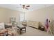 Well-lit bedroom with ample floor space, cozy seating, and bright natural light for play and relaxation at 127 Marlow Dr, Woodstock, GA 30188