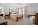 Cozy bedroom with four-poster bed, pink accents and decorative features at 127 Marlow Dr, Woodstock, GA 30188