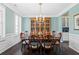 Formal dining room with wainscoting, hardwood floors, chandelier, and built in hutch at 127 Marlow Dr, Woodstock, GA 30188