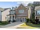 Charming brick two-story home with a covered front porch and a two-car garage at 127 Marlow Dr, Woodstock, GA 30188