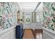 Stylish foyer with hardwood floors, patterned wallpaper, and natural light from the front door at 127 Marlow Dr, Woodstock, GA 30188