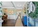 Beautiful foyer featuring hardwood floors, floral wallpaper, and access to a dining area at 127 Marlow Dr, Woodstock, GA 30188