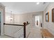 Hallway with decorative lighting, bench, and view into bathroom at 127 Marlow Dr, Woodstock, GA 30188