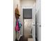 Entryway with storage hooks, dark wood floors, and natural light, creating an inviting and functional space at 127 Marlow Dr, Woodstock, GA 30188