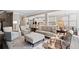 Bright, open-concept living room featuring hardwood floors, neutral furniture, and views into the kitchen at 127 Marlow Dr, Woodstock, GA 30188